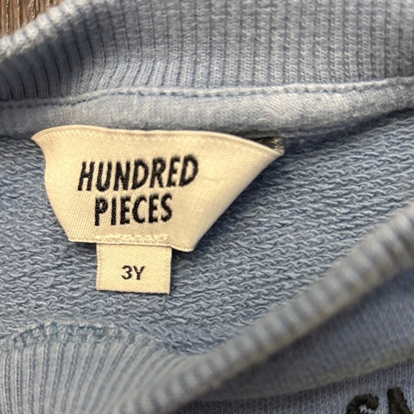 Hundred Pieces Blue Sweatshirt with Yellow Smile Patch - Picture 4 of 12